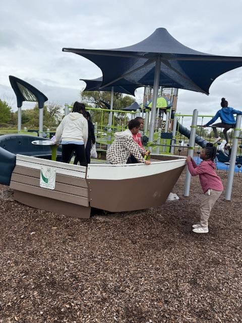  Student is a play boat on Belle Isle.